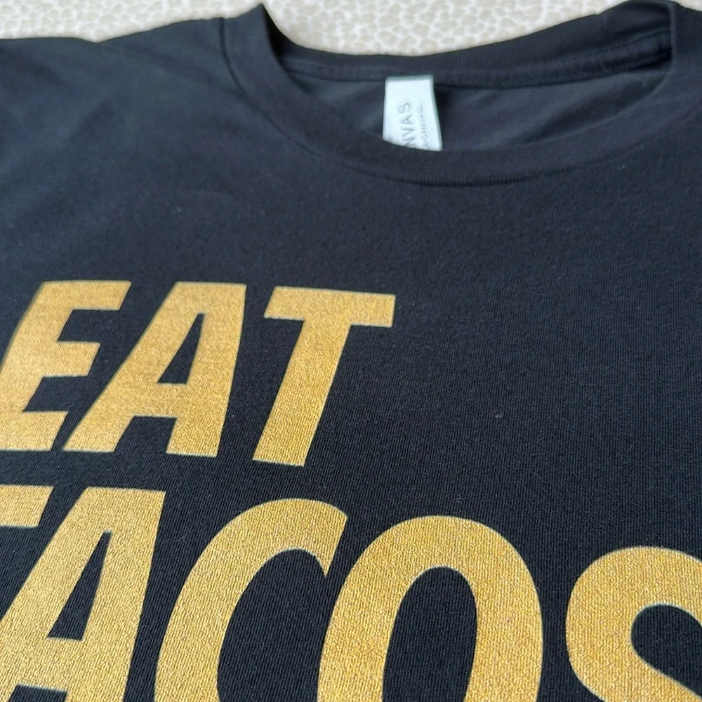NWOT Bella-Canvas Black & Gold “Eat Tacos.Pet Dogs.” Short Sleeve T-Shirt size M